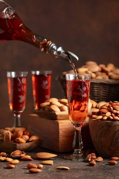 Italian Liqueur Amaretto Almonds Nuts Vintage Table Liqueur Poured Bottle — Stock Photo, Image