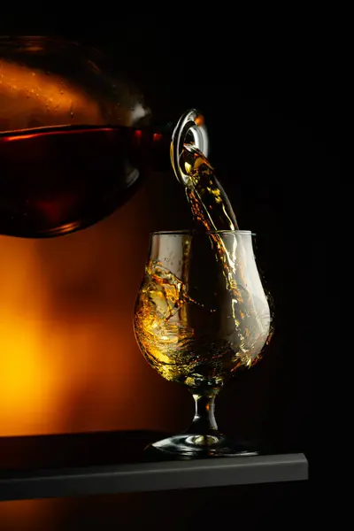 Cognac Brandy Being Poured Glass Brandy Snifter Dark Background Stock Picture