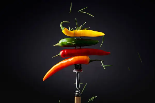 Colorful Hot Chili Peppers Sprinkled Rosemary Black Background Concept Spicy — Stock Photo, Image