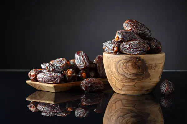 Dates Wooden Dish Black Reflective Background Royalty Free Stock Images