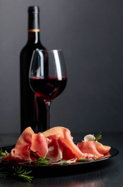 Italian prosciutto or Spanish jamon with rosemary and red wine.