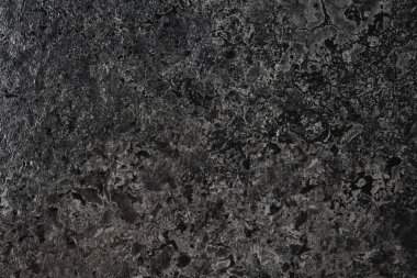 Siyah taş dokusu. Pürüzsüz ve parlak siyah taş, önden görüş.