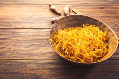 Curcuma seaweed noodles made from alginate (Sodium Alginate). Fresh kelp noodles as healthy alternative