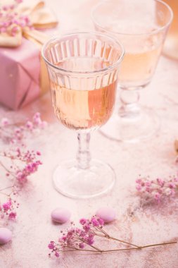 Rose sparkling wine, french macarons and box of chocolates for Valentime, mothers day or birthday