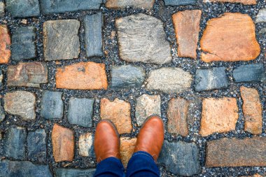The pavement of granite stone. Paved roadway street, texture, background, selective focus.