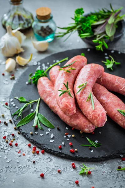 Raw Sausages Slate Herbs Spices Prepared Grill Bbq — Stock Photo, Image