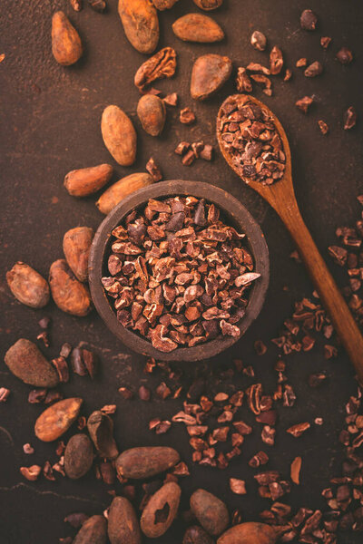Organic cacao beans and nibs in small bowl 