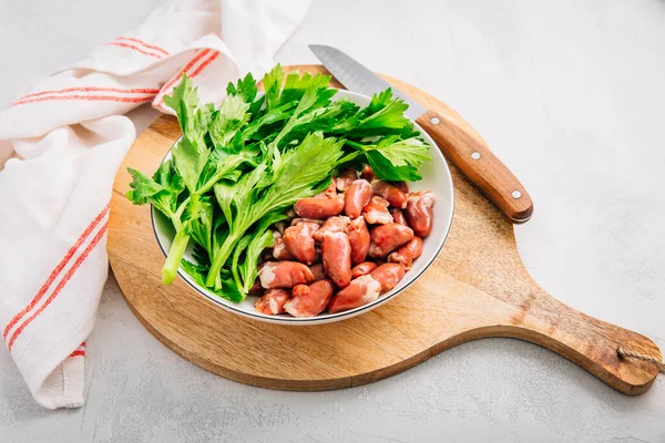 Fresh Raw Chicken Hearts Celery Leaves Reading Cooking — Stock Photo, Image
