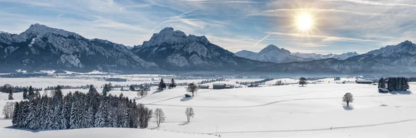 calm panoramic winter landscape with snow and mountain range