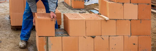 stock image bricklayer at work at new house in construction