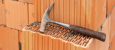 bricklayer at work at new house in construction