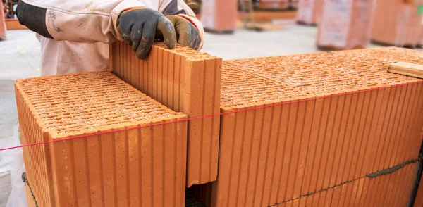 stock image bricklayer at work at new house in construction