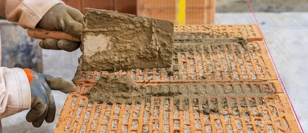 stock image bricklayer at work at new house in construction