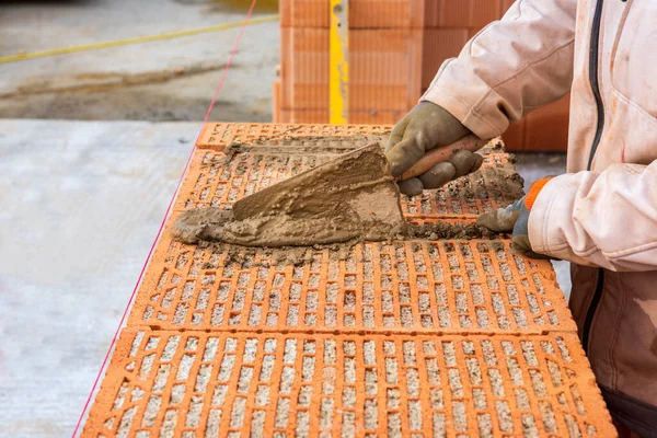 Stock image bricklayer at work at new house in construction