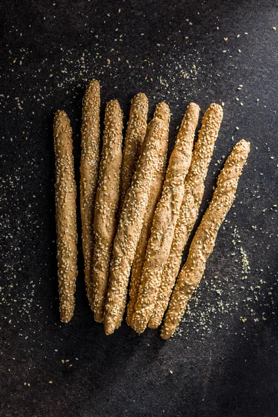 Italian Grissini Bread Sticks Sesame Seeds Black Table Top View — Stock Photo, Image