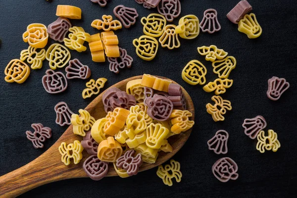Pasta Various Scary Shapes Uncooked Halloween Pasta Spoon Black Table — Stock Photo, Image