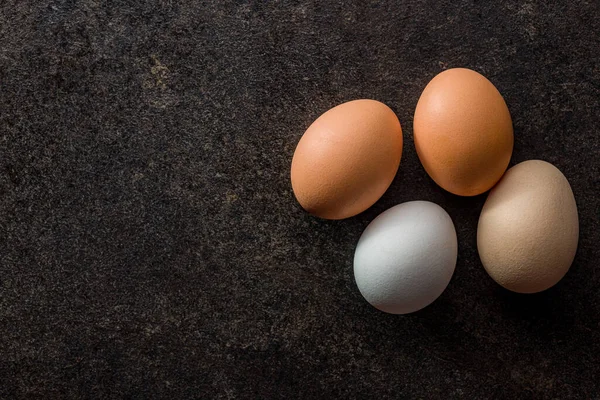 Whole Chicken Eggs Black Table Top View — Stock Photo, Image