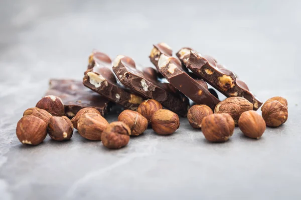Broken Chocolate Bars Nuts Kitchen Table — Stock Photo, Image