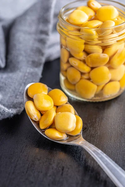 Lupini Beans Brine Pickled Lupin Spoon Black Table — Stock fotografie