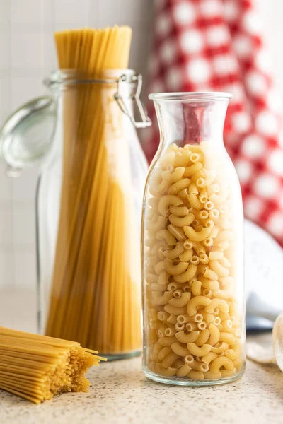 Raw Macaroni Pasta Glass Bottle Uncooked Rigatoni Glass Bottle — Stock Photo, Image