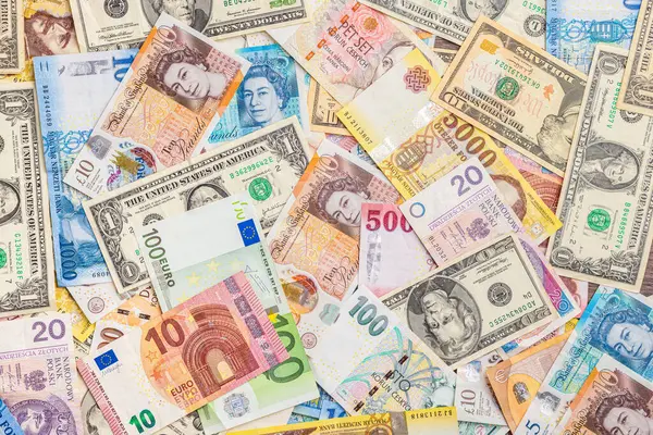 The banknotes background. Various currencies. Paper money. Euro, Czech crown, Polish zloty, Hungarian forint, British pound and  US dollar. Top view.