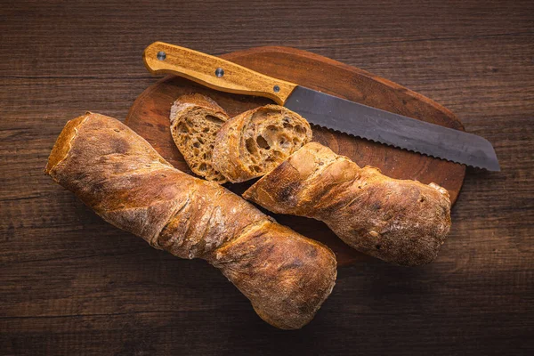 Sliced Wholegrain Rustical Baguette Wooden Table Top View — Stock Photo, Image
