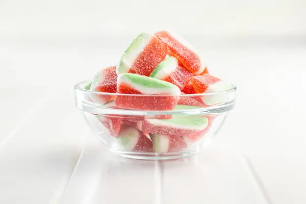Watermelon jelly candies  in bowl on the kitchen table.