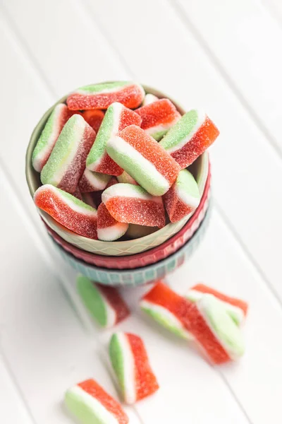 Watermelon jelly candies  in bowl on the kitchen table.