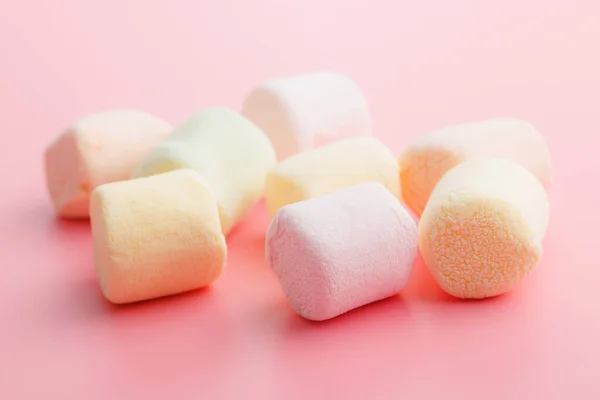 stock image Sweet marshmallows candy on the pink background.