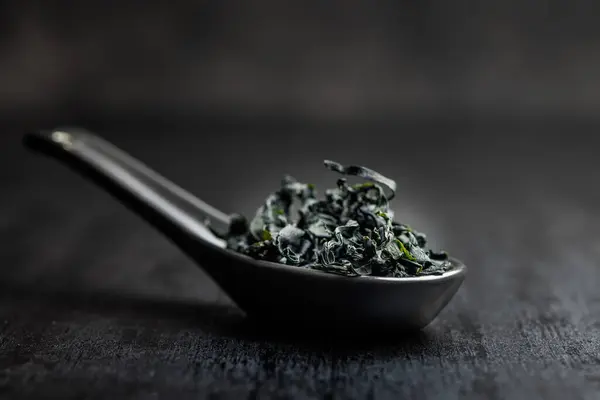 Dried Wakame Seaweed Spoon Black Table Royalty Free Stock Images