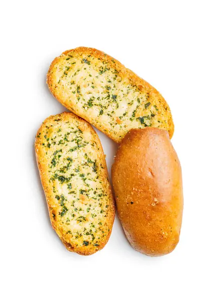 ニンニクのパンのスライスは白い背景で隔離されたハーブと交配しました ロイヤリティフリーのストック写真