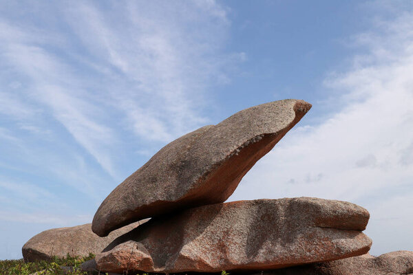 Bizarre boulders and rocks on the Pink Granite Coast on the island of Renote in Brittany, France