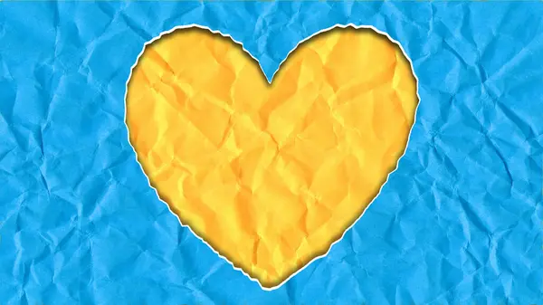 Yellow heart on blue paper, heart symbol in the colors of Ukraine