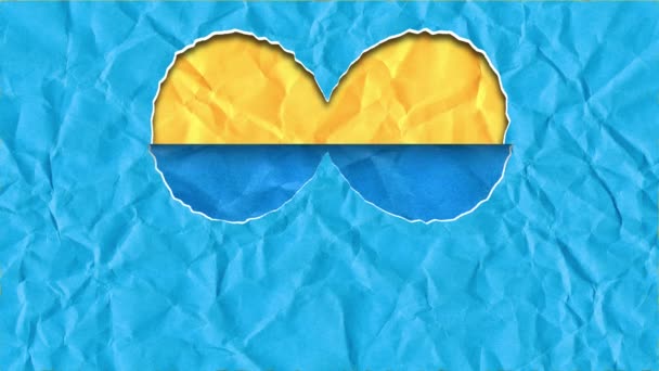 Selembar Kertas Dalam Bentuk Hati Dengan Warna Bendera Ukraina Cuplikan — Stok Video