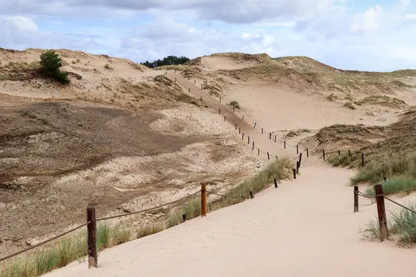 stock image Tourist trail through the dunes near Czolpino village  in the Slovincian National Park, Poland