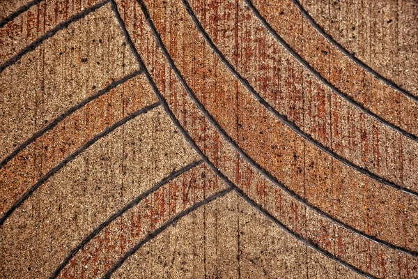Detalle Diseño Genérico Líneas Curvas Sobre Pavimento Antiguo Tonos Naranja — Foto de Stock