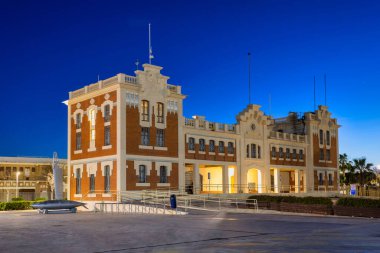 Historic architecture at the Valencia marina at night, Spain.