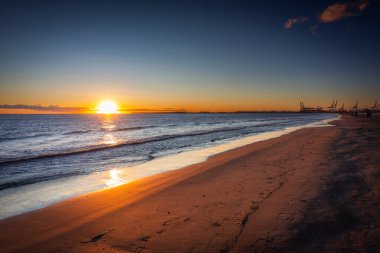 Playa de las Arenas beach by the Mediterranean Sea in Valencia at sunrise. Spain