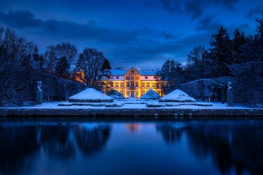 Winter scenery in snowy public park in Gdansk Oliwa, Poland