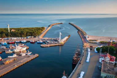 Ustka, Poland - July 8, 2023: Beautiful harbour in Ustka town by the Baltic Sea at summer, Poland. clipart