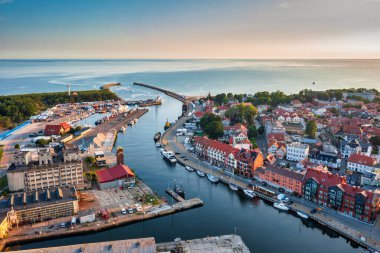 Beautiful sunrise over the Ustka town by the Baltic Sea, Poland. clipart