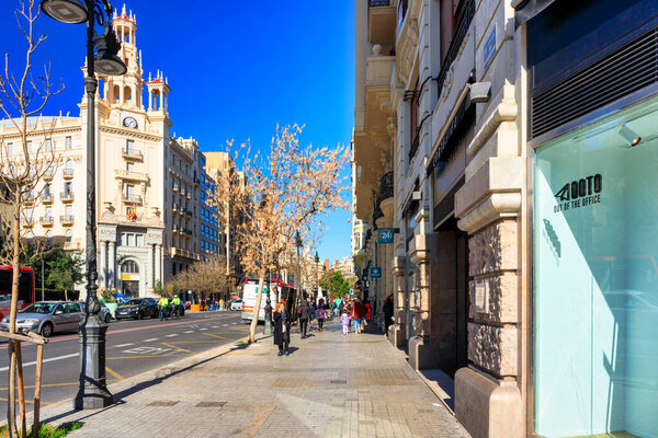 Valencia, Spain - January 21, 2023: Street of the old town in Valencia city at sunny day, Spain.