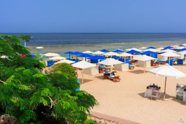 Marsa Alam, Egypt - May 10, 2023: Beach area of the Akassia Swiss Resort by the Red Sea in Marsa Alam, Egypt.