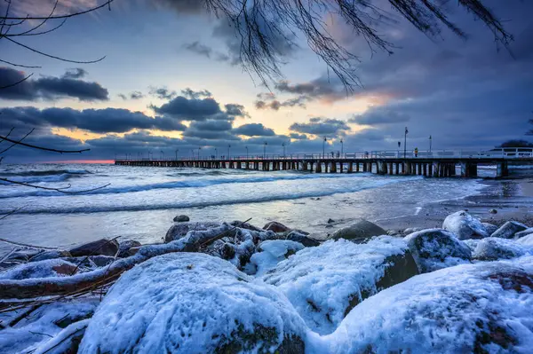 Winter landscape of Baltic Sea coast in Gdynia Orlowo at sunrise, Baltic Sea. Poland