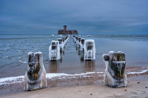 Frozen Baltic Sea beach in Babie Doly at sunset, Gdynia. Poland