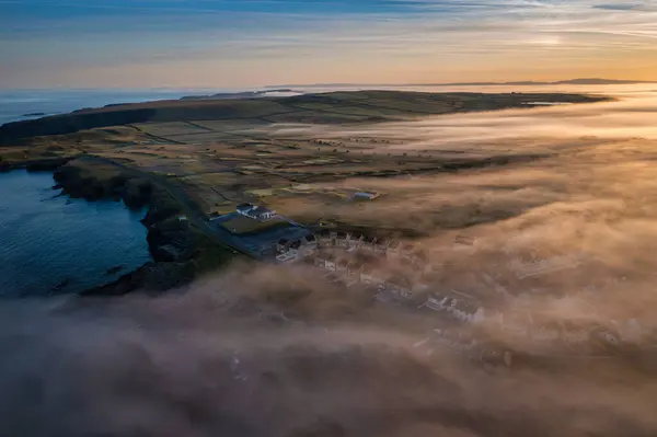 stock image Misty sunrise over the rocky coast of Kilkee, Co. Clare. Ireland