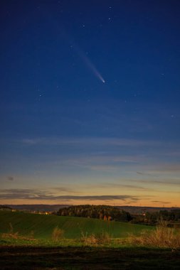 Comet C/2023 A3 Tsuchinshan-ATLAS passing over the sky in Poland. clipart