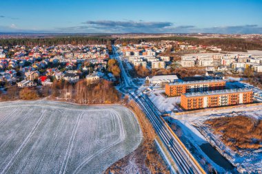 Aerial landscape of the road through snowy Rotmanka village at winter, Poland. clipart