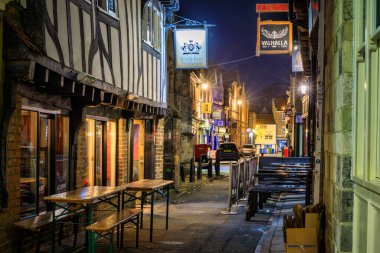 York, United Kingdom - October 20, 2024: The Shambles at night - one of the best-preserved medieval shopping streets in Europe, York. UK clipart