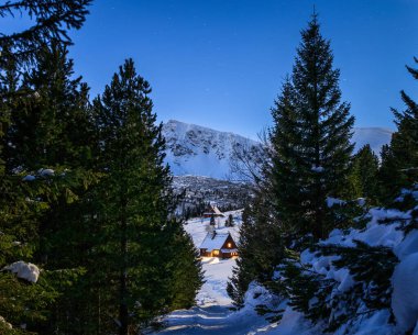 Night scenery of Hala Gasienicowa in the winter Tatra Mountains. Poland clipart